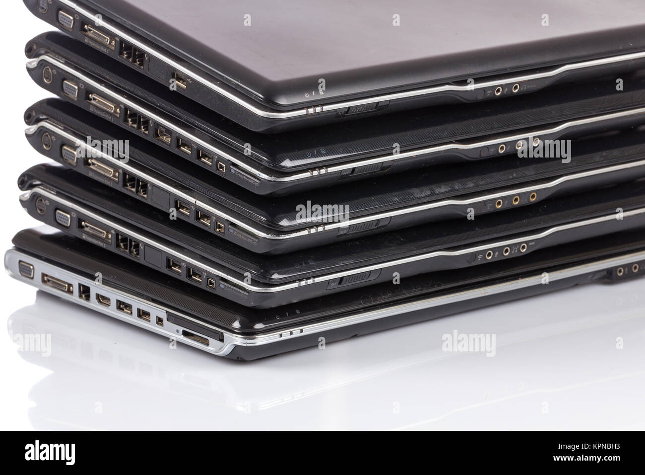stack of old laptops awaiting repair Stock Photo Alamy