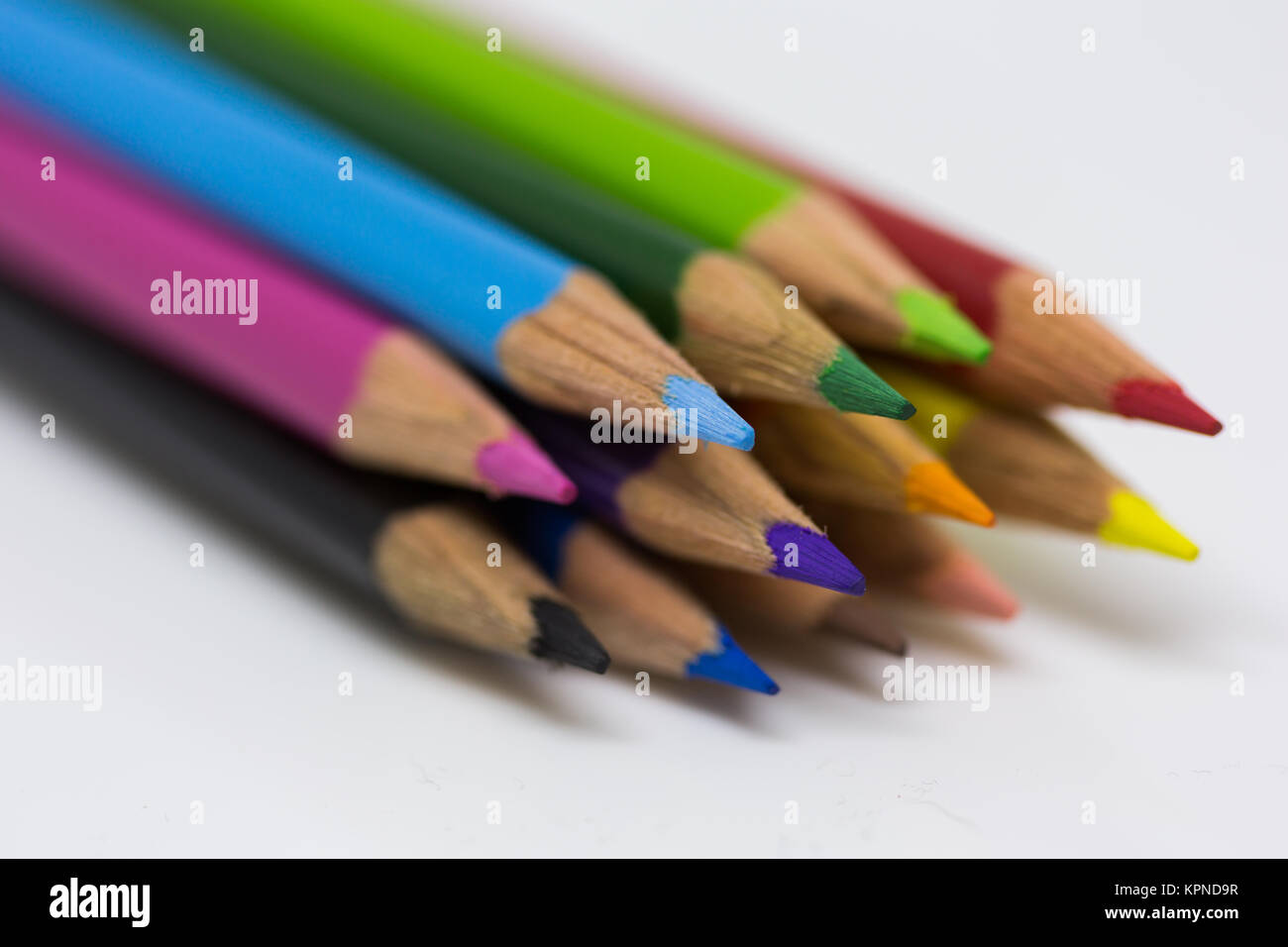 Coloured pencils bundled together with a