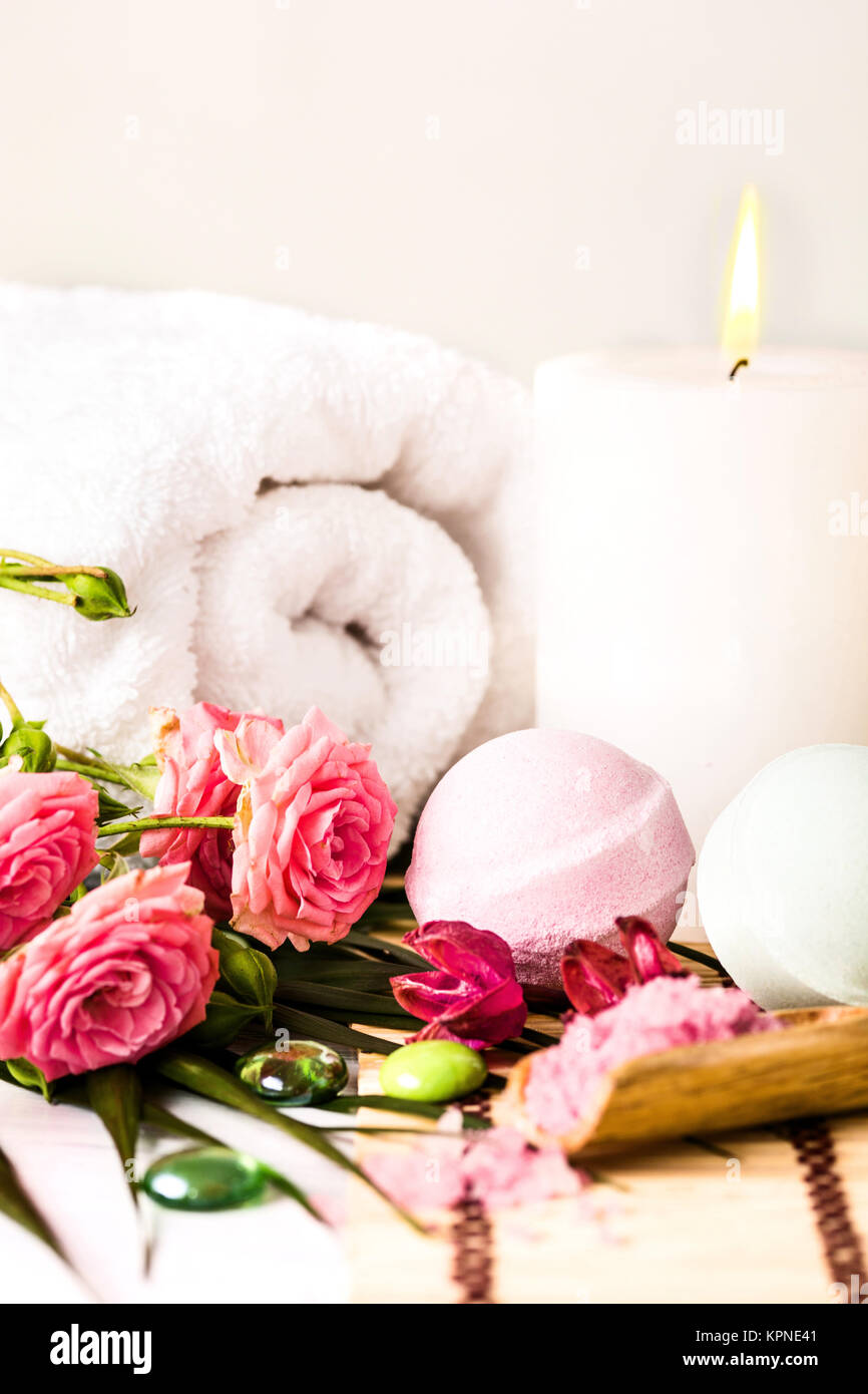 Spa setting with pink roses and aroma oil, vintage style Stock Photo