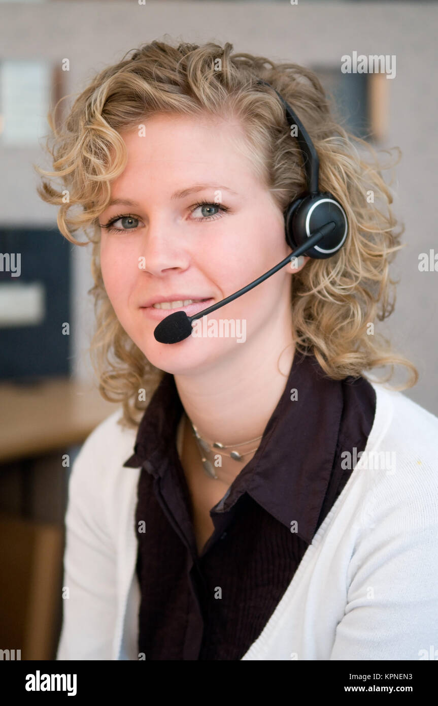 Attentive customer service representative smiling hires stock