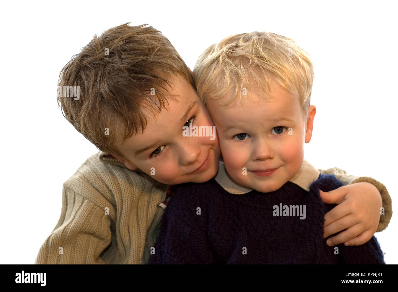 Two lovely brothers, 5 and 2 years of age. On white background. Stock Photo