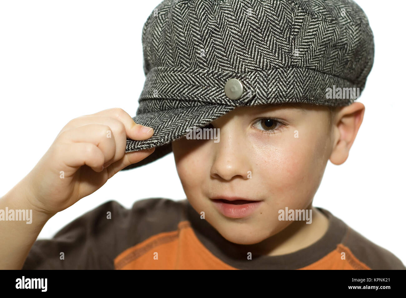 Boy holding his hat Stock Photo