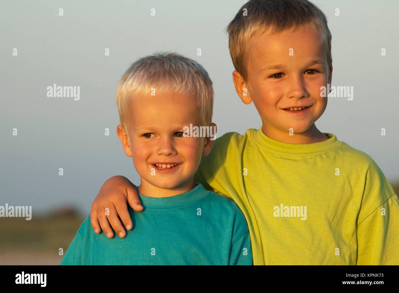 Two Brothers During Sunset Stock Photo