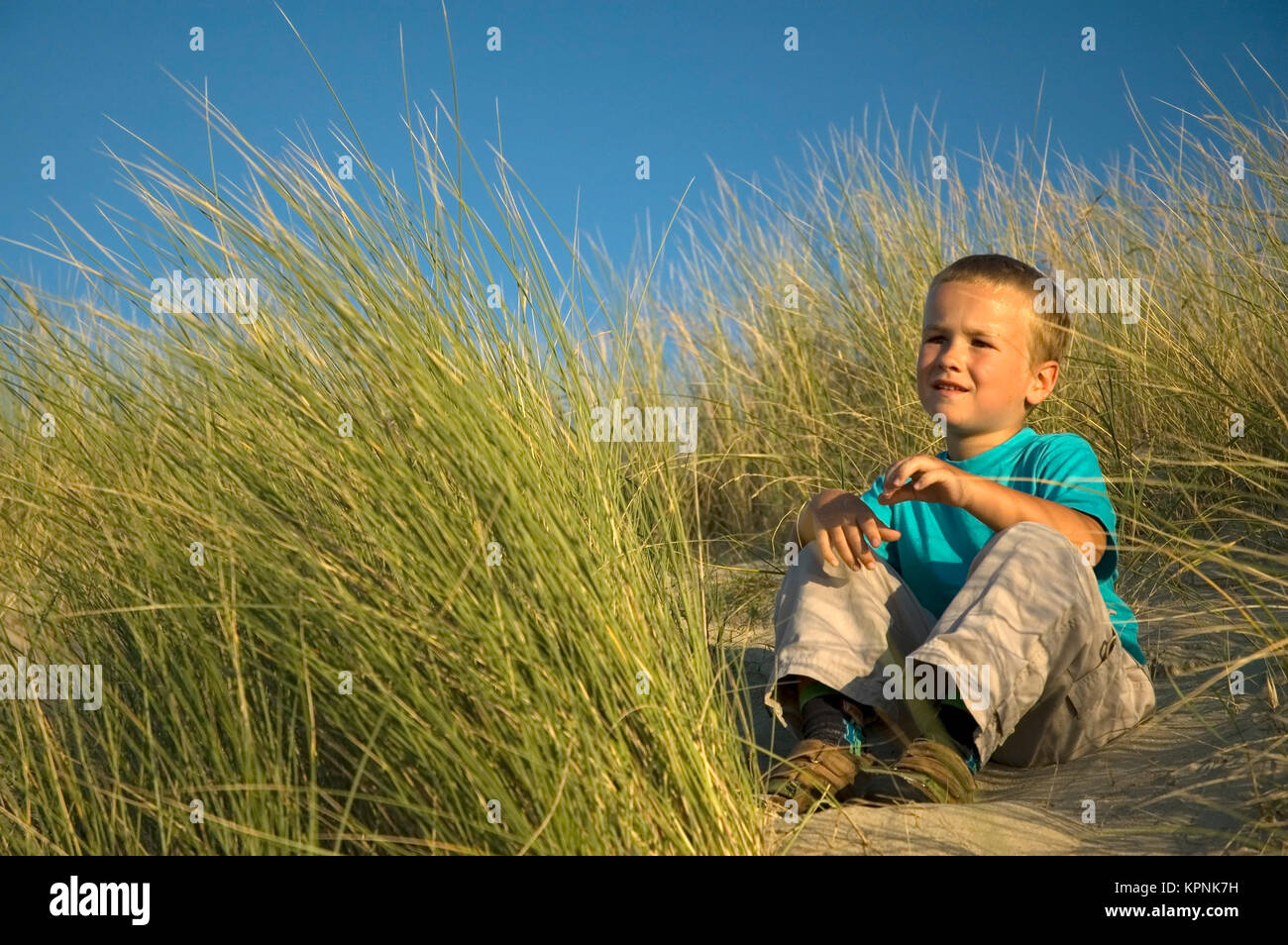 Boy In The Dunes Stock Photo