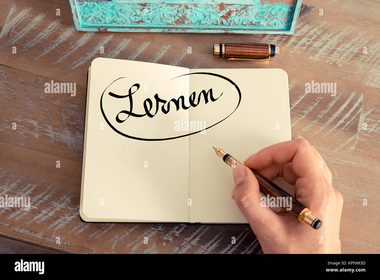 Handwritten text in German &amp;quot; Lernen&amp;quot; - translation Stock Photo - Alamy
