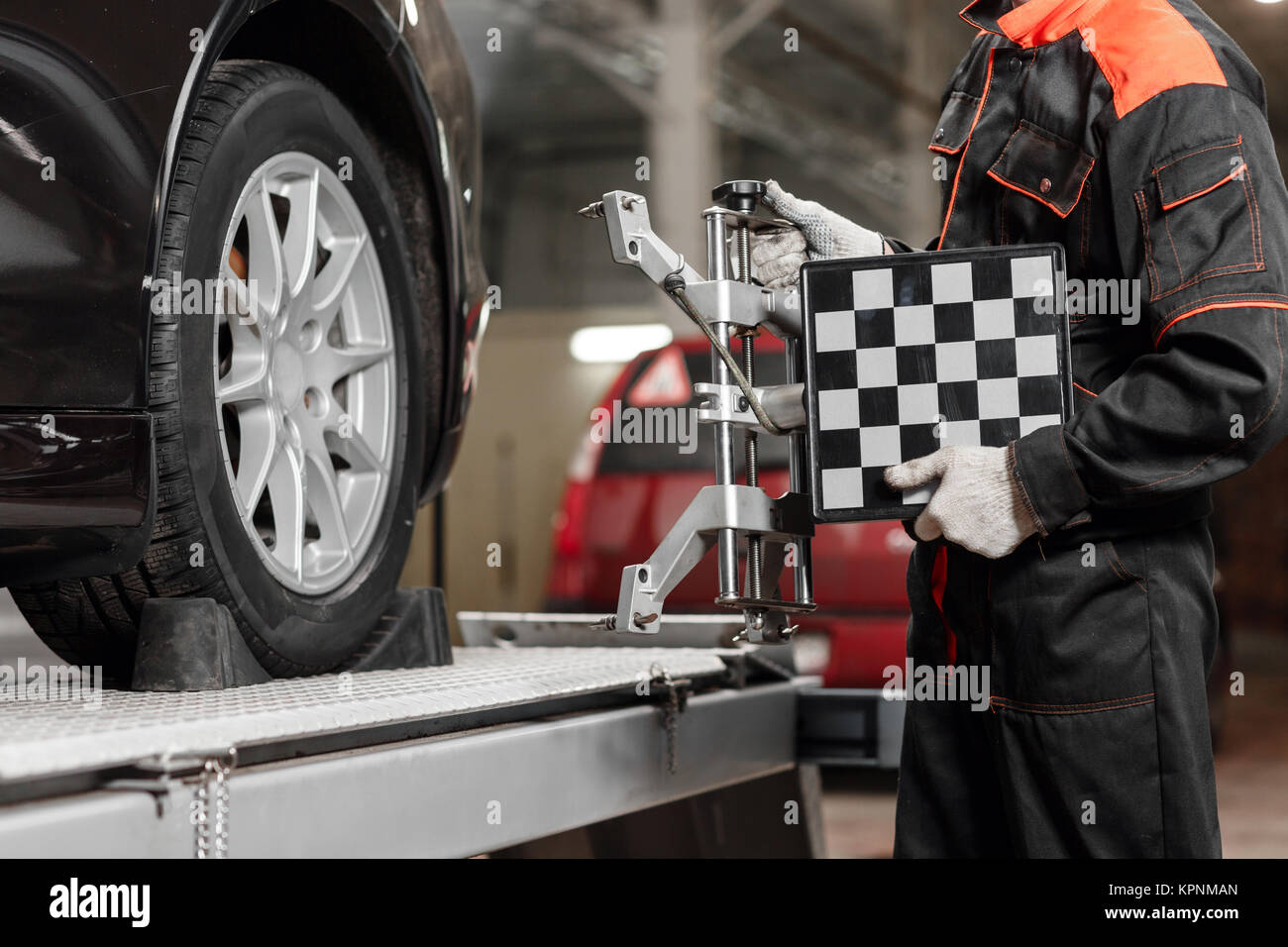 auto mechanic sets the car for diagnostics and configuration. Wheel