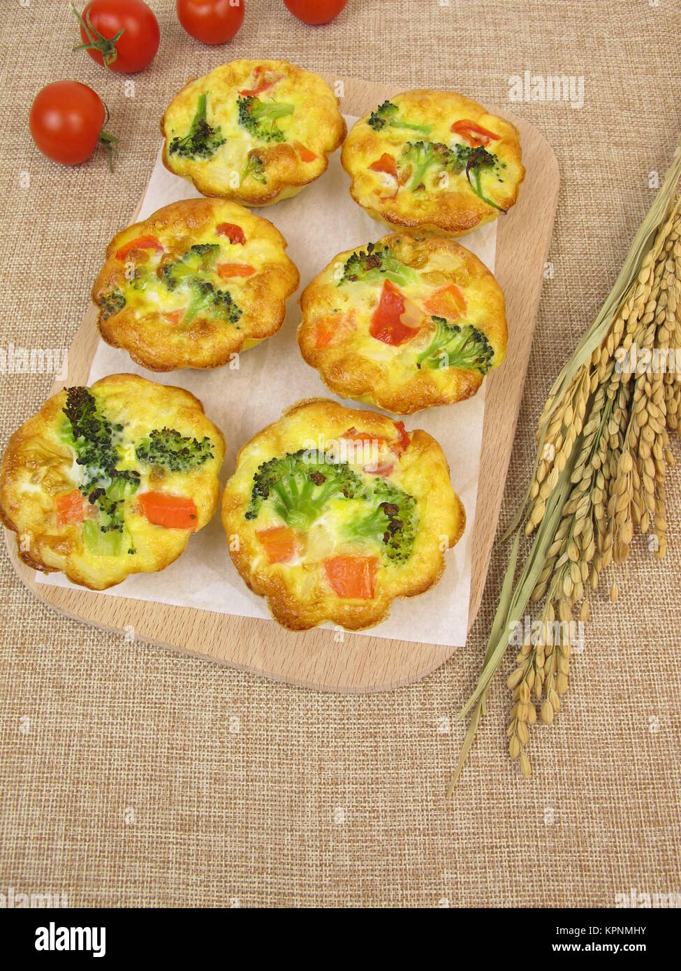 muffin frittatas with rice,carrots,broccoli and tomatoes Stock Photo