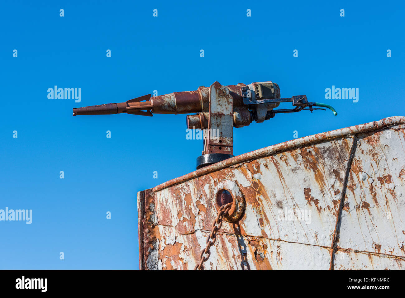 Close-up of rusty harpoon gun in bows Stock Photo