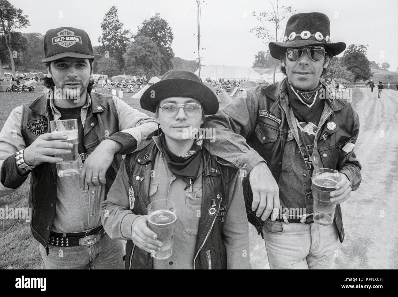 Three bikers drinking beer. Scenes from the Harley Davidson rally in the grounds of Littlecote House, Berkshire, England ion 30th September 1989. The rally was hosted by Peter de Savary who owned the house at that time. Stock Photo