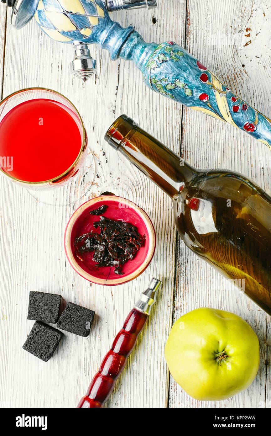 smoking Arab hookah and a glass of young wine pink Stock Photo Alamy