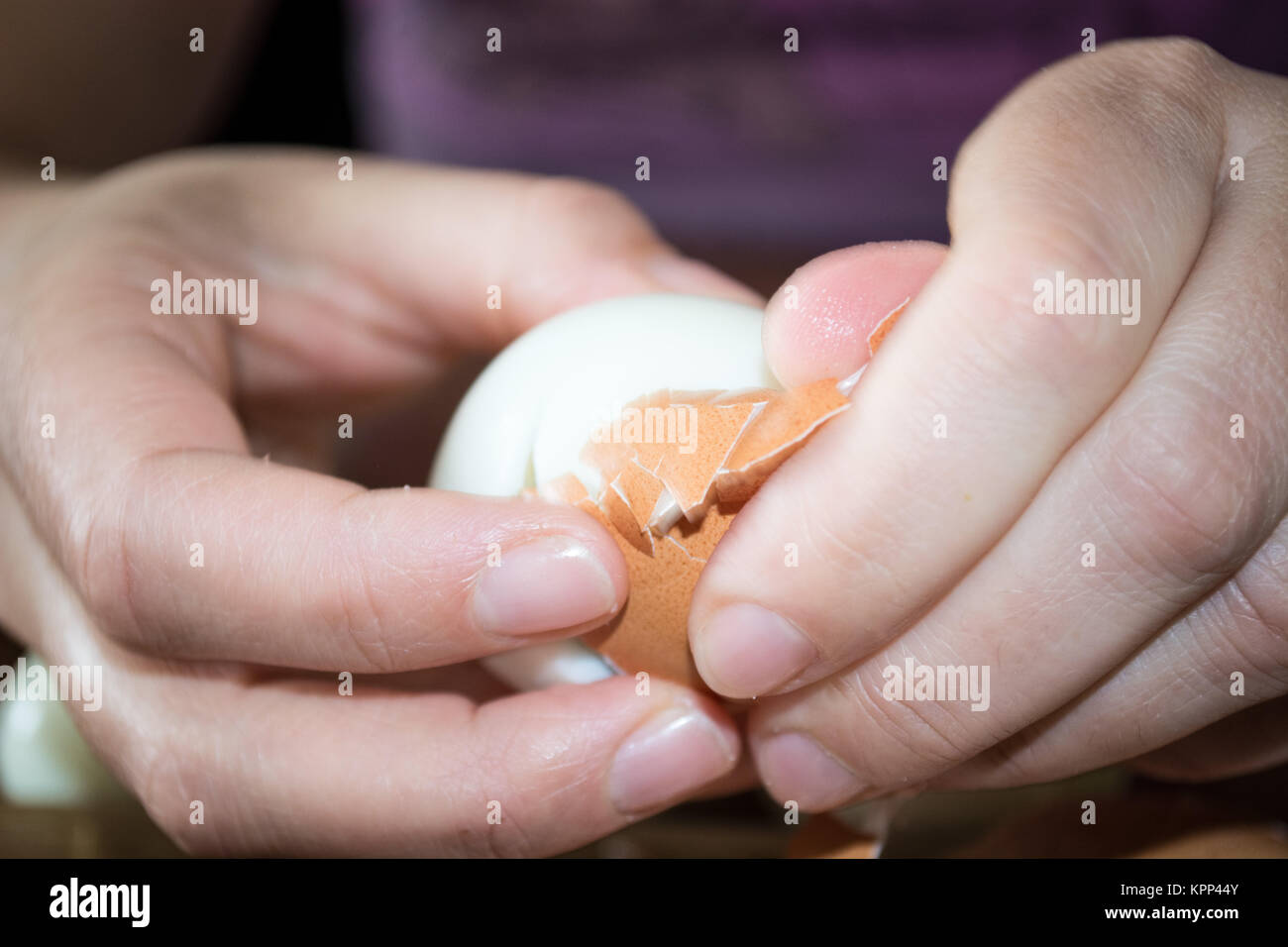 Cleaning boiled eggs Stock Photo Alamy