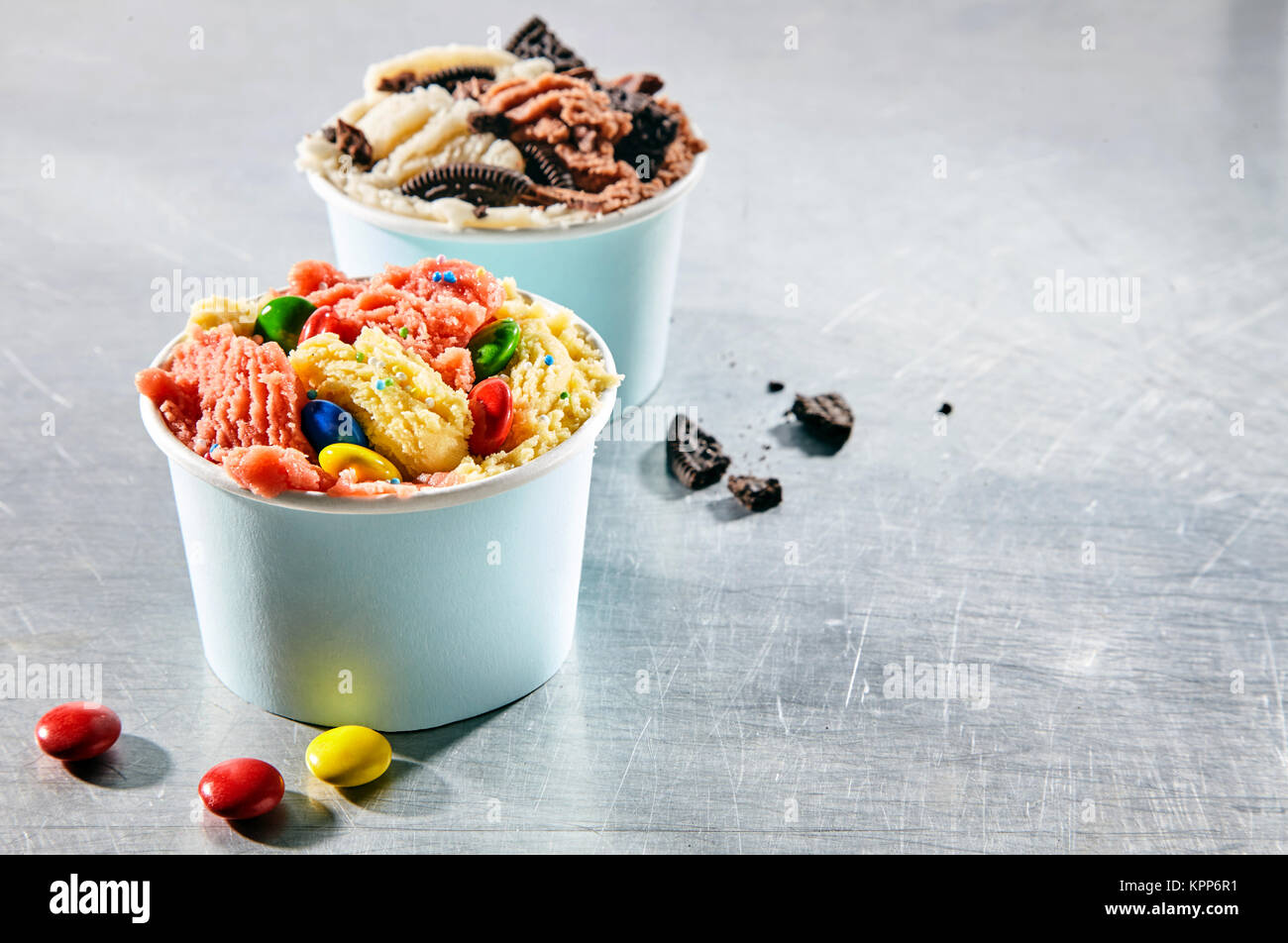 Two dessert take out containers filled with creamy frozen italian