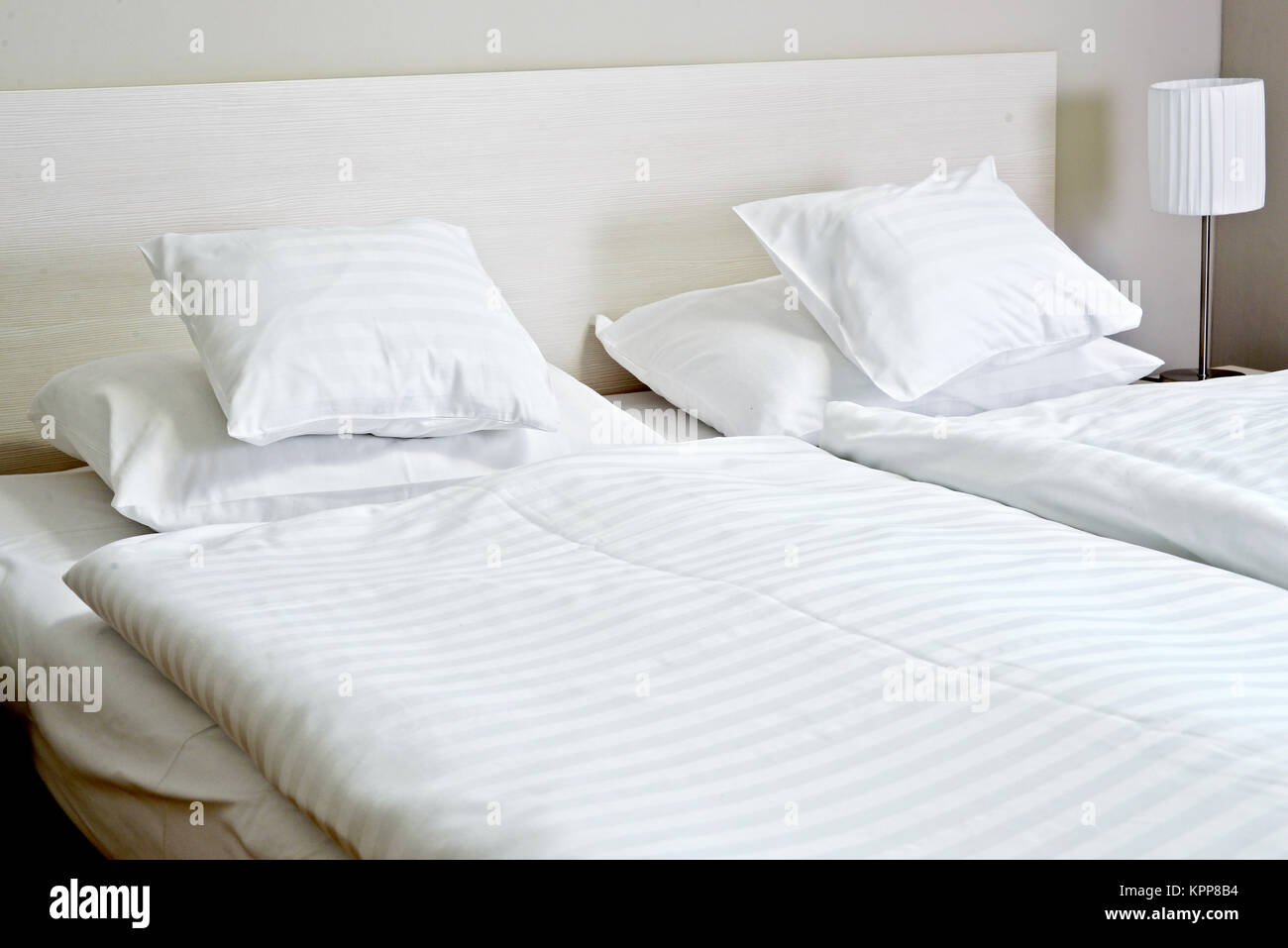 Double bed in hotel room. Stock Photo Alamy