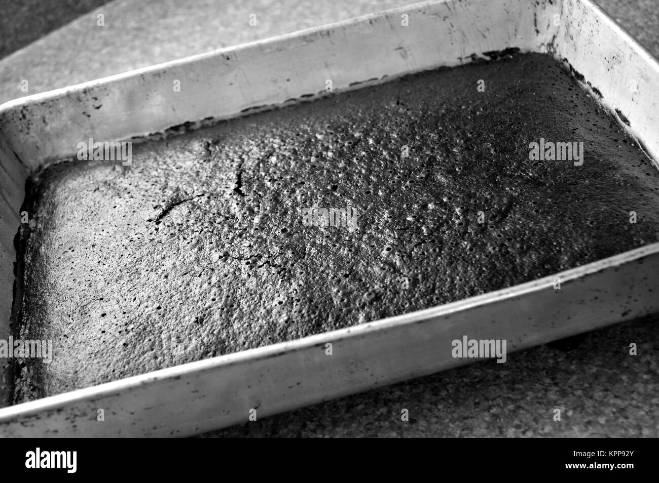 Black and white, chocolate cake in pan Stock Photo Alamy