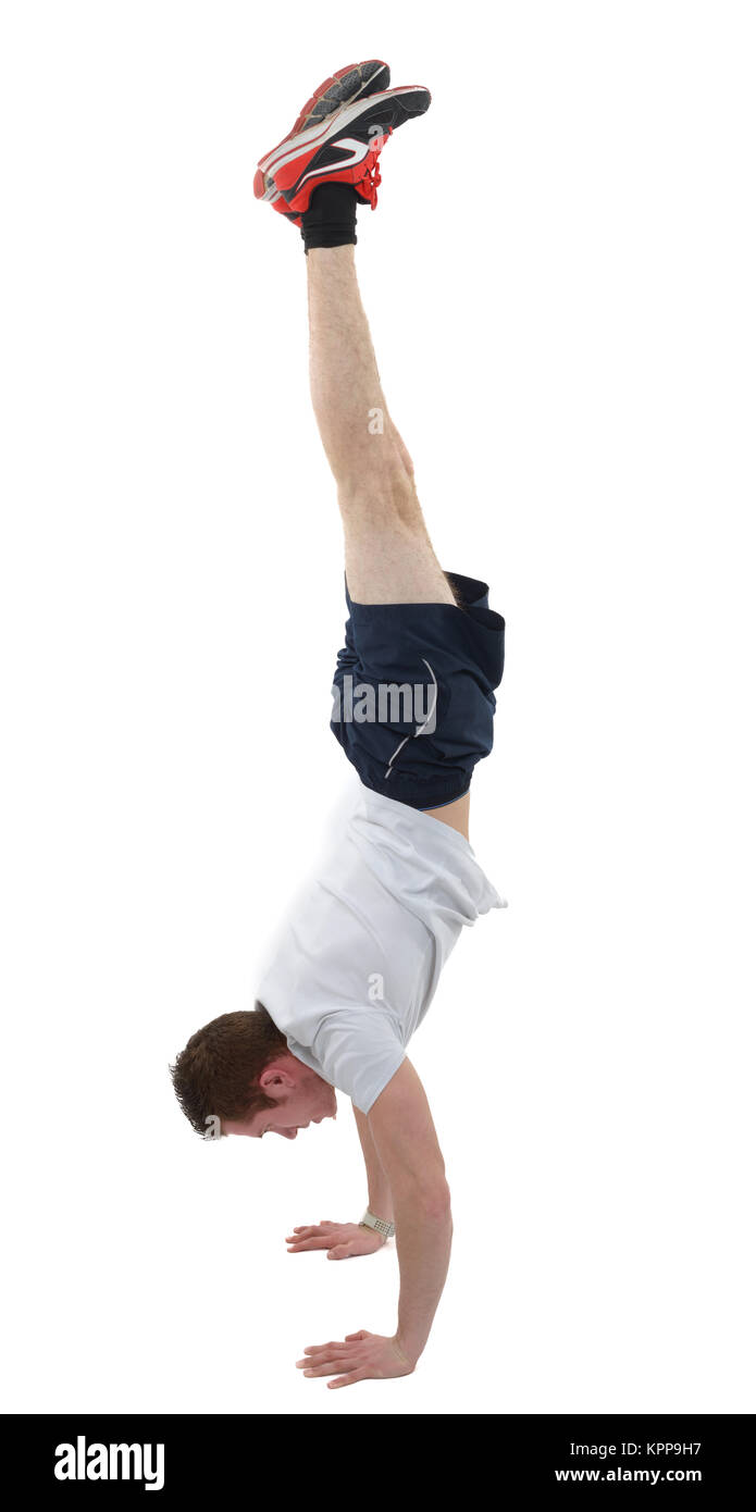 man doing the handstand on white background Stock Photo