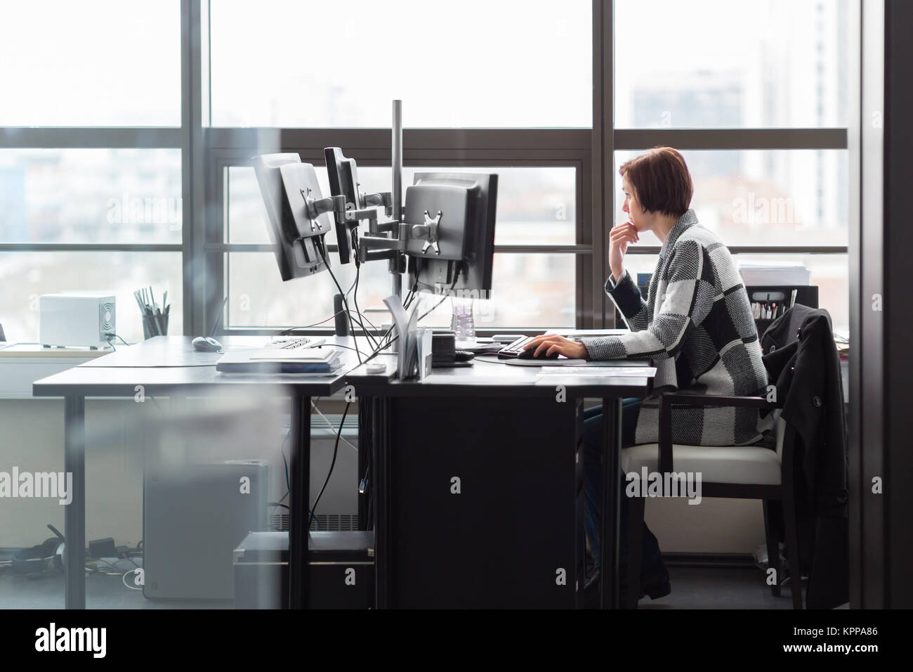 Business woman working in corporate office Stock Photo - Alamy