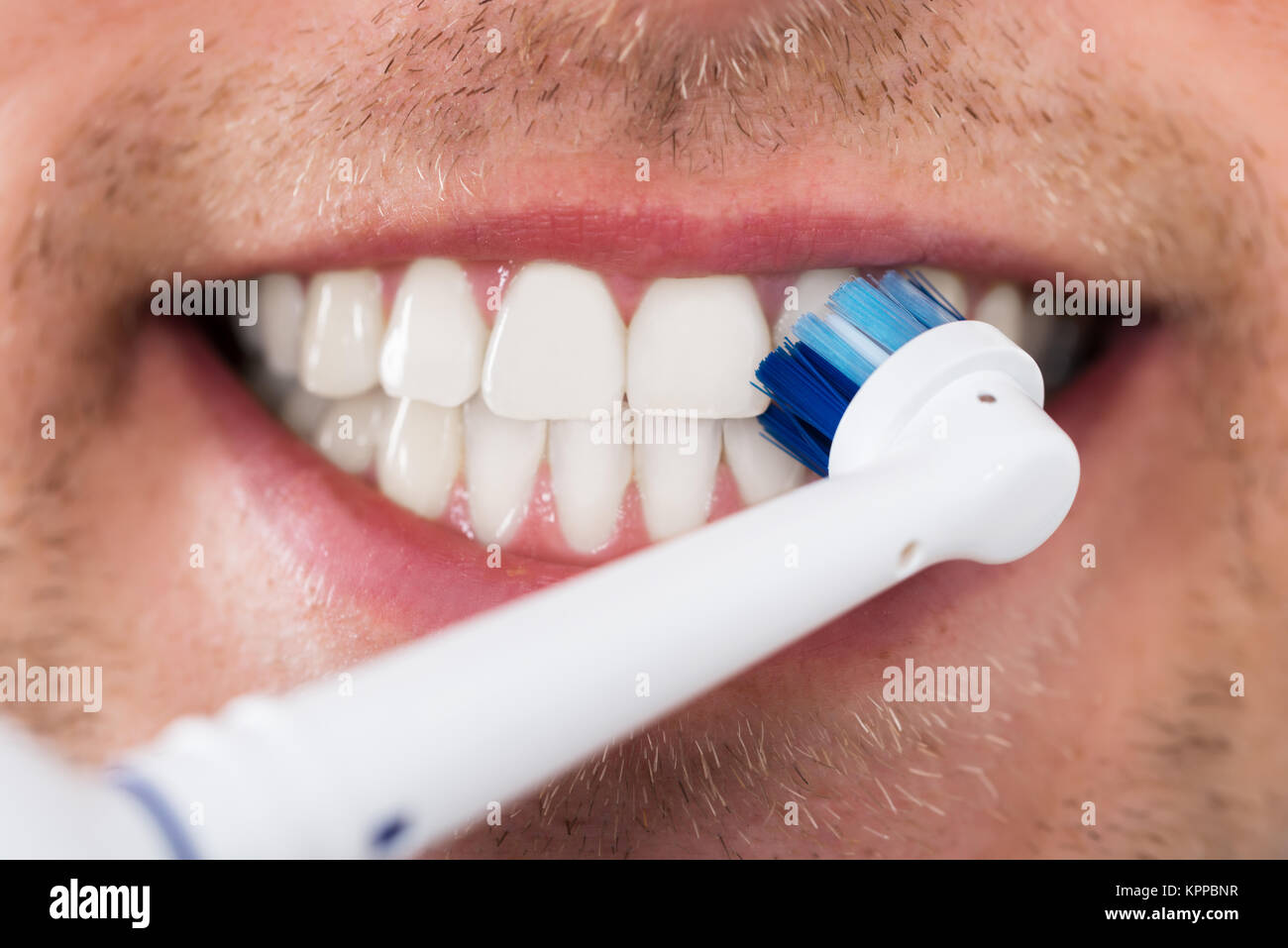 Man Teeth With Electric Toothbrush Stock Photo Alamy