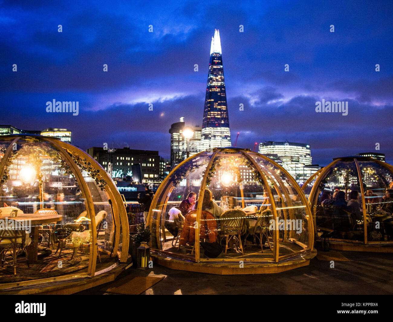 'Igloo's' at the Coppa Club restaurant with the 'Shard' skyscraper in the background, London, England Stock Photo
