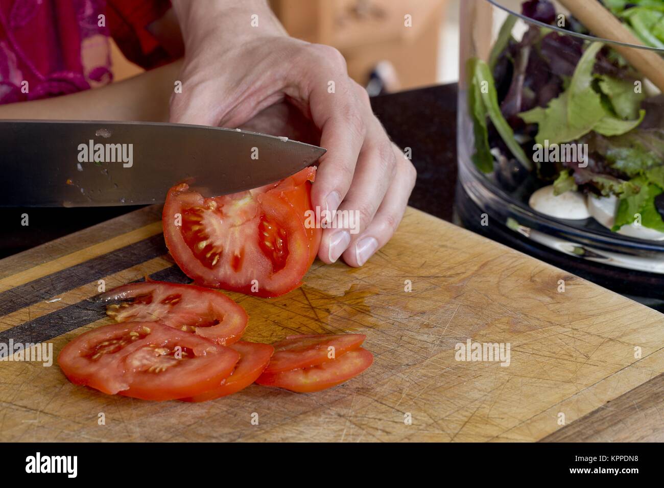 knife slicing tomato Stock Photo Alamy