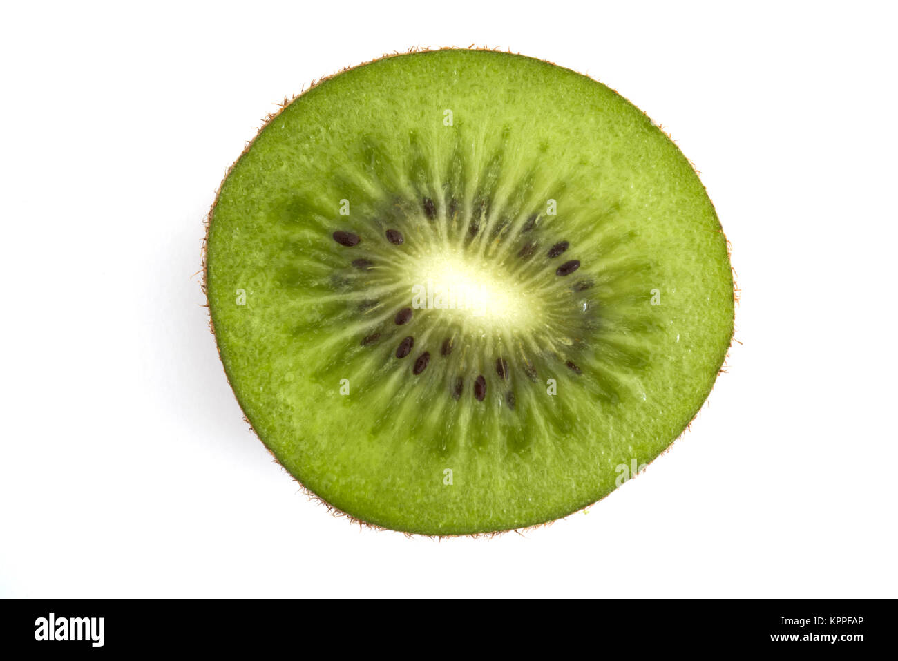 Macro view of a Kiwi fruit cut in half isolated on white background Stock Photo