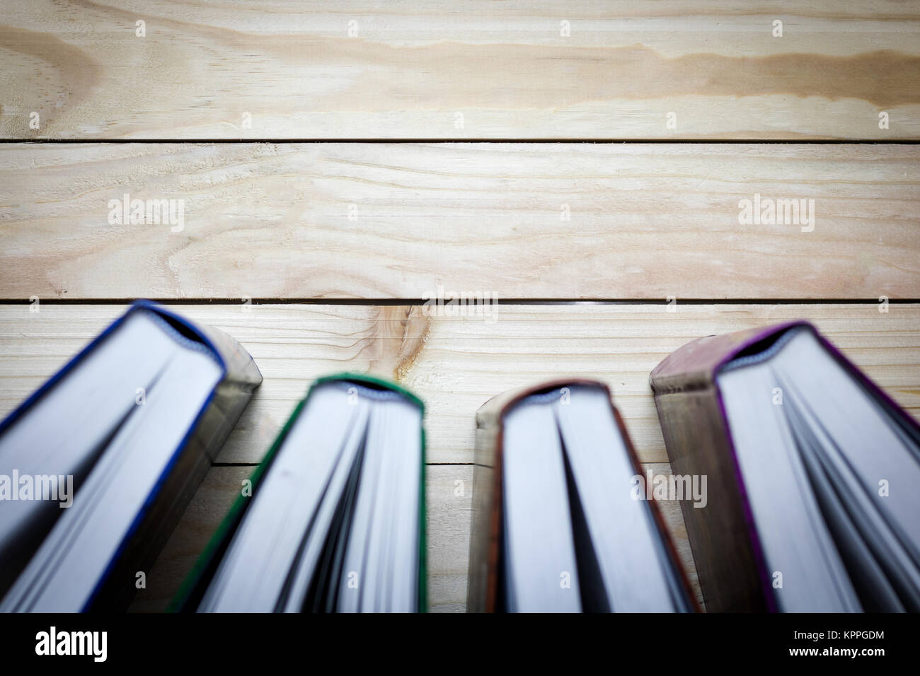 spine of book on wood background with copy space Stock Photo - Alamy