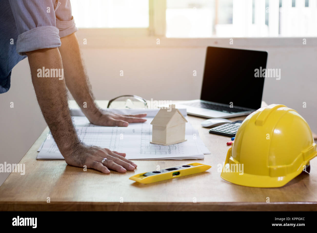 Enginee or architect looking on plan paper on desk, architect and working concept Stock Photo