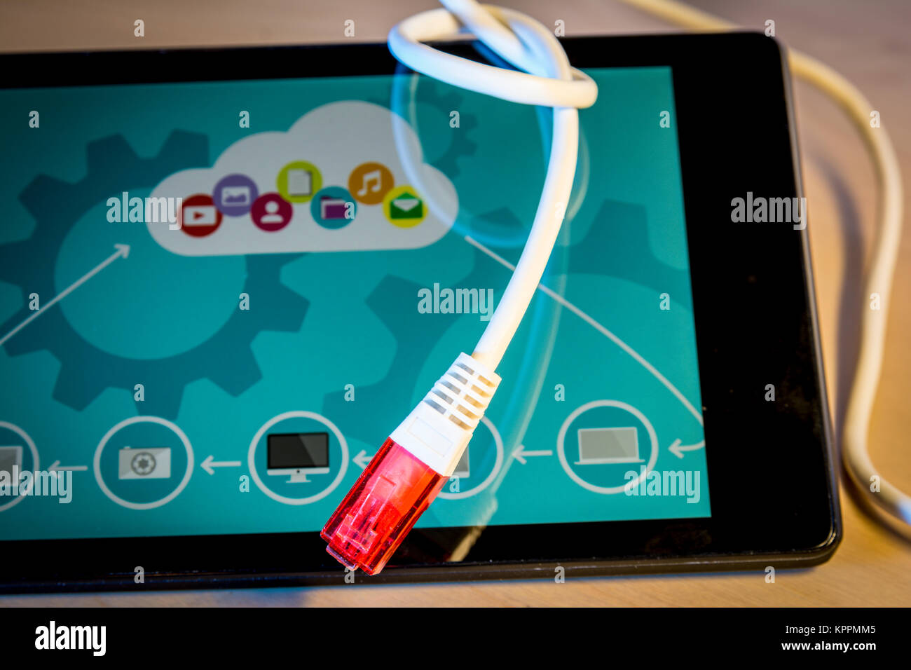 knotted net cable over a smartphone withcoud computing icons on screen ...