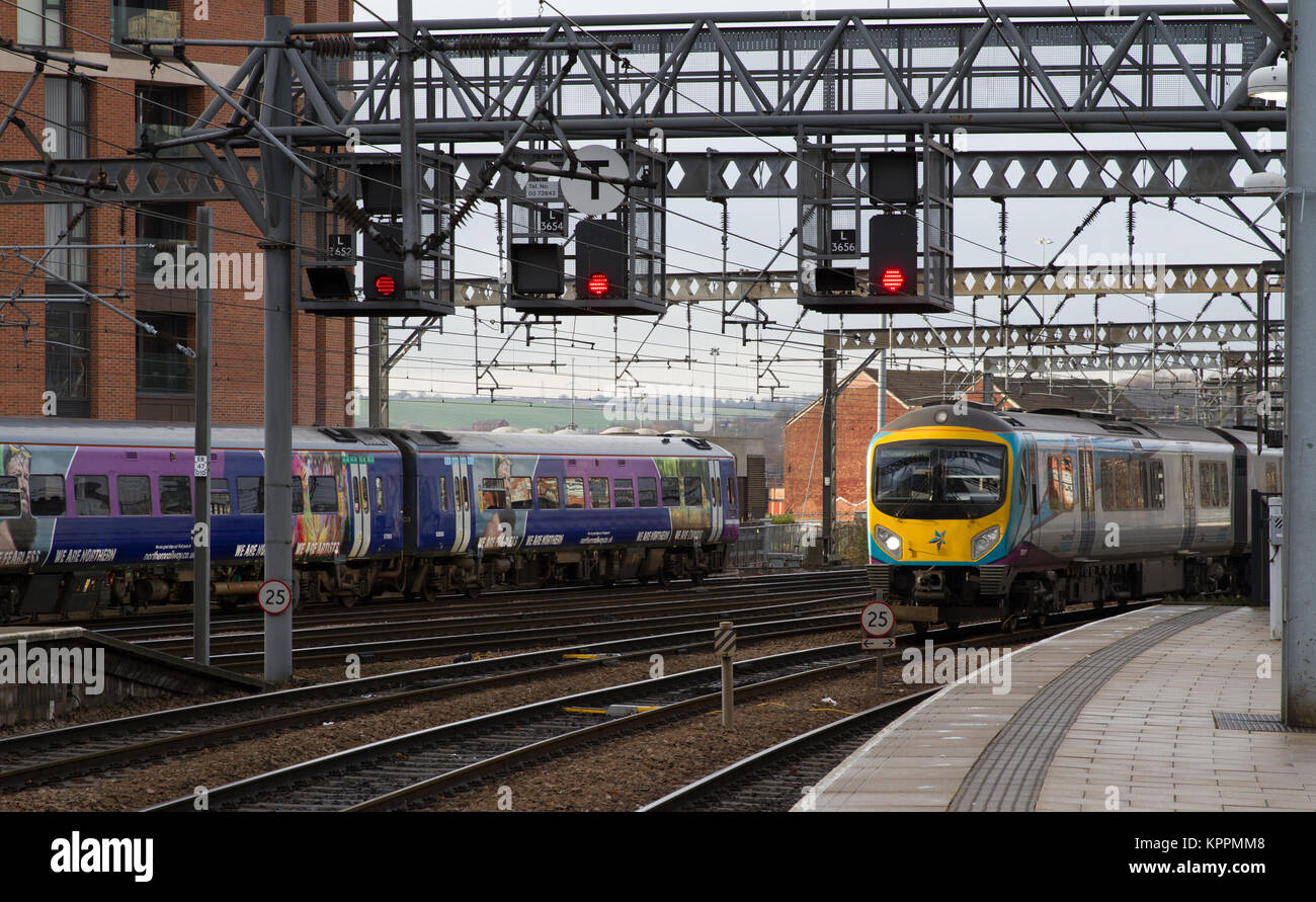 Trans Pennine Express and Northern Arriva Rail North Services pass at Leeds Railway Station Stock Photo