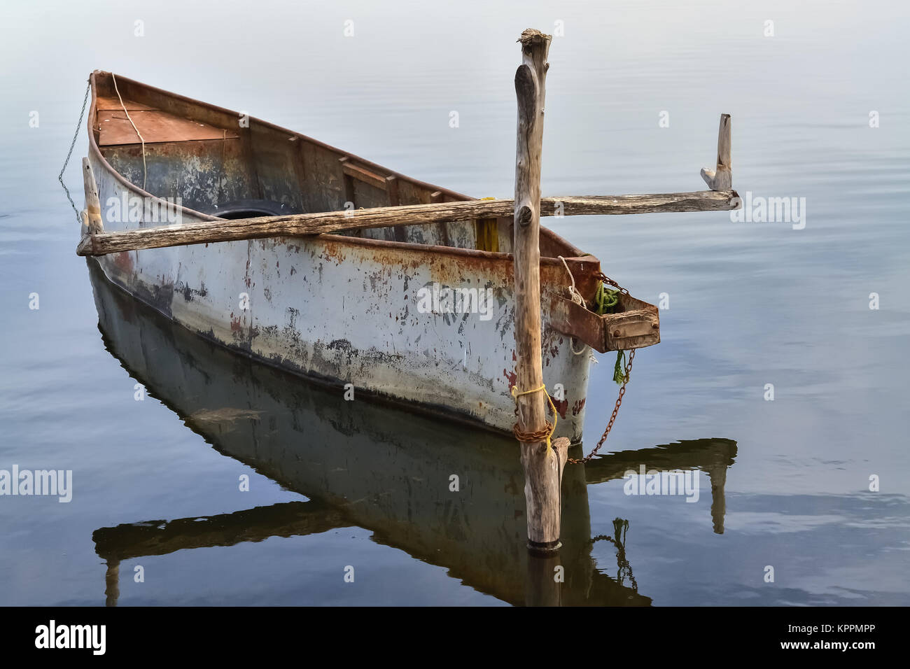 Closeup of a docked metal fishing boat floating in the water Stock Photo -  Alamy