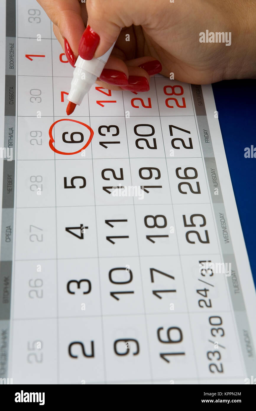 Date Friday 6 is marked on the calendar. Red marker. Stock Photo