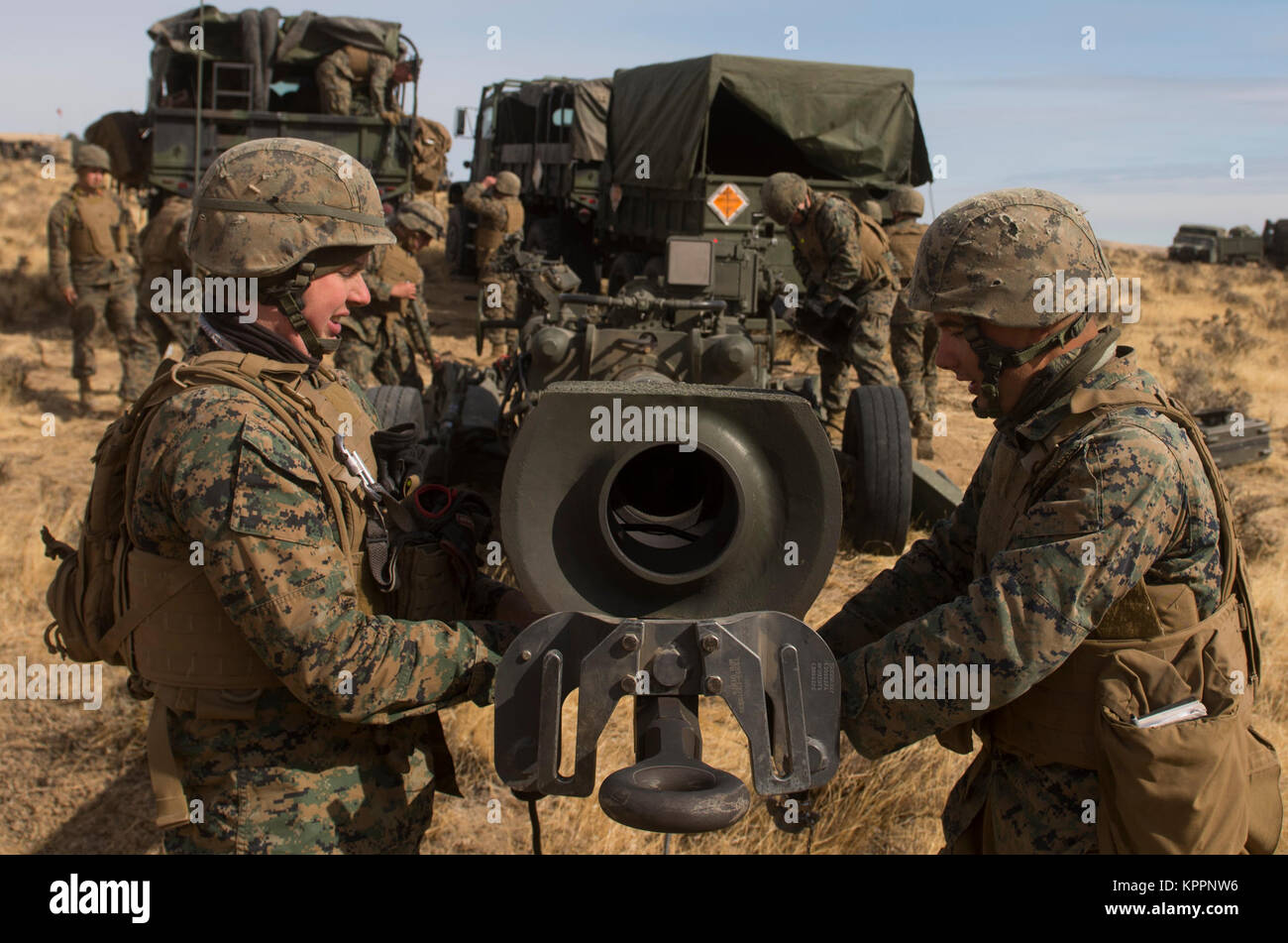 Marines of P Battery 5/14 break down a M777A2 howitzer weapon system