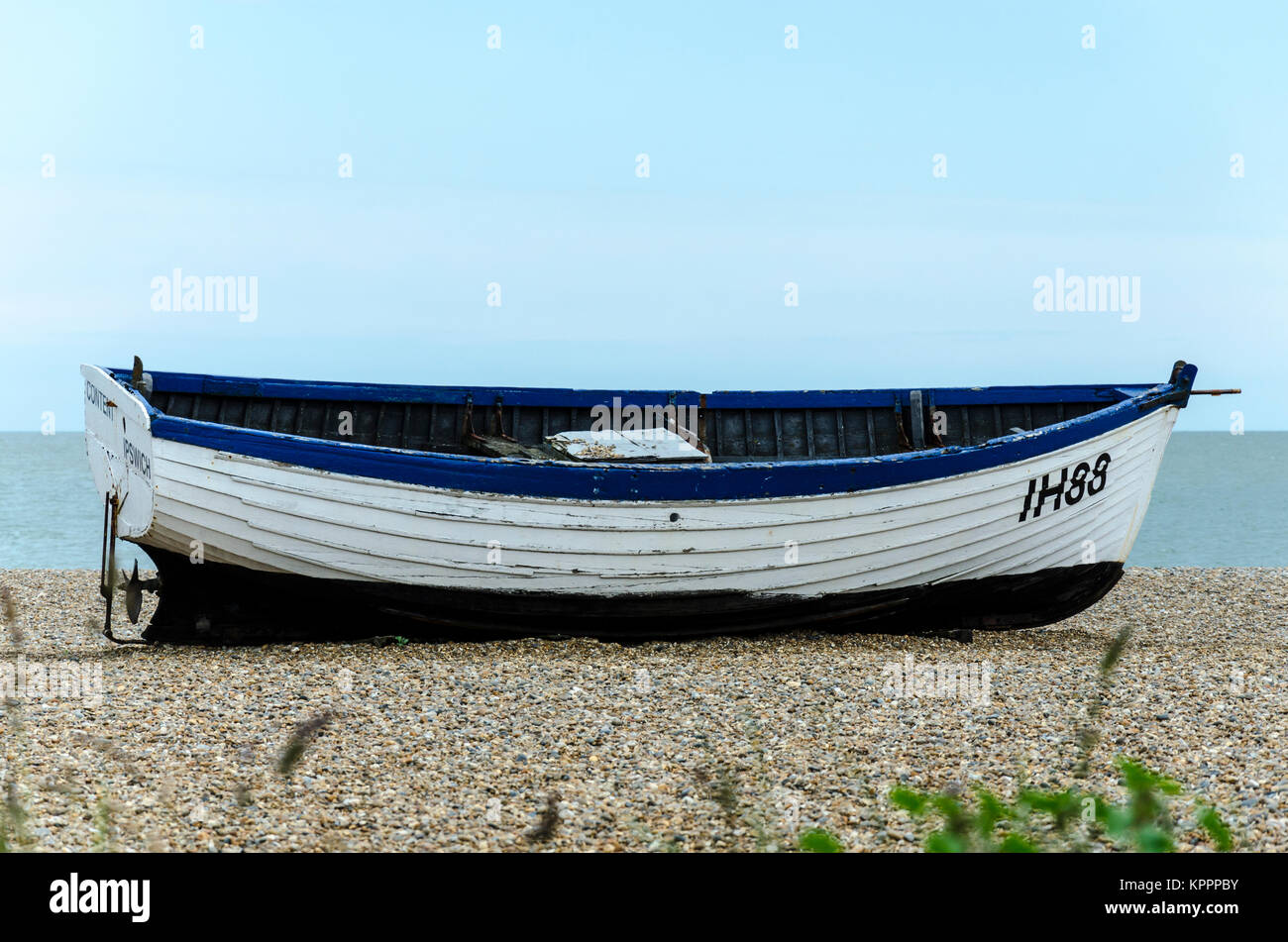 Small boat on Aldeburgh beach, Aldeburgh English coastal town in Suffolk, UK Stock Photo