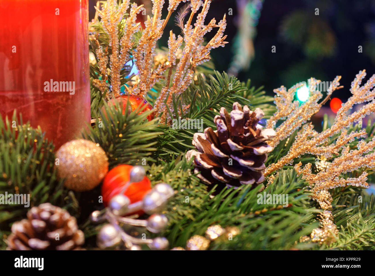 Christmas decoration with fresh tree branches, cones and red candle ...
