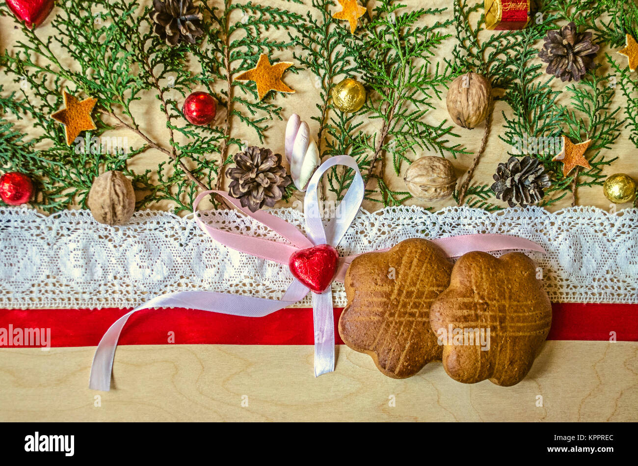 Biscuits on a red ribbon and lace edging, chocolate heart with a bow