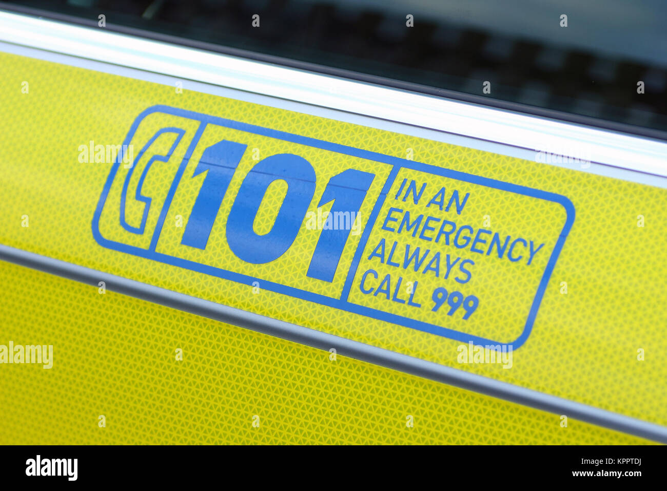 Close-up of side of Police Scotland police car, showing dial 101 and 999 information Stock Photo