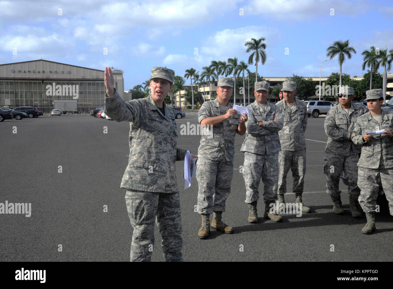 Reserve Citizen Airman Tech. Sgt. Christine Kearney-Kurt, a historian for the 624th Regional Support Group, explains the historic significance of the Base Operations building during a battlefield staff ride at Joint Base Pearl Harbor-Hickam, Hawaii, Dec. 3, 2017. The tour focused on the remnants of war from 76 years ago during the Dec. 7, 1941, attack at Hickam Field when America was launched into World War II. (U.S. Air Force Stock Photo
