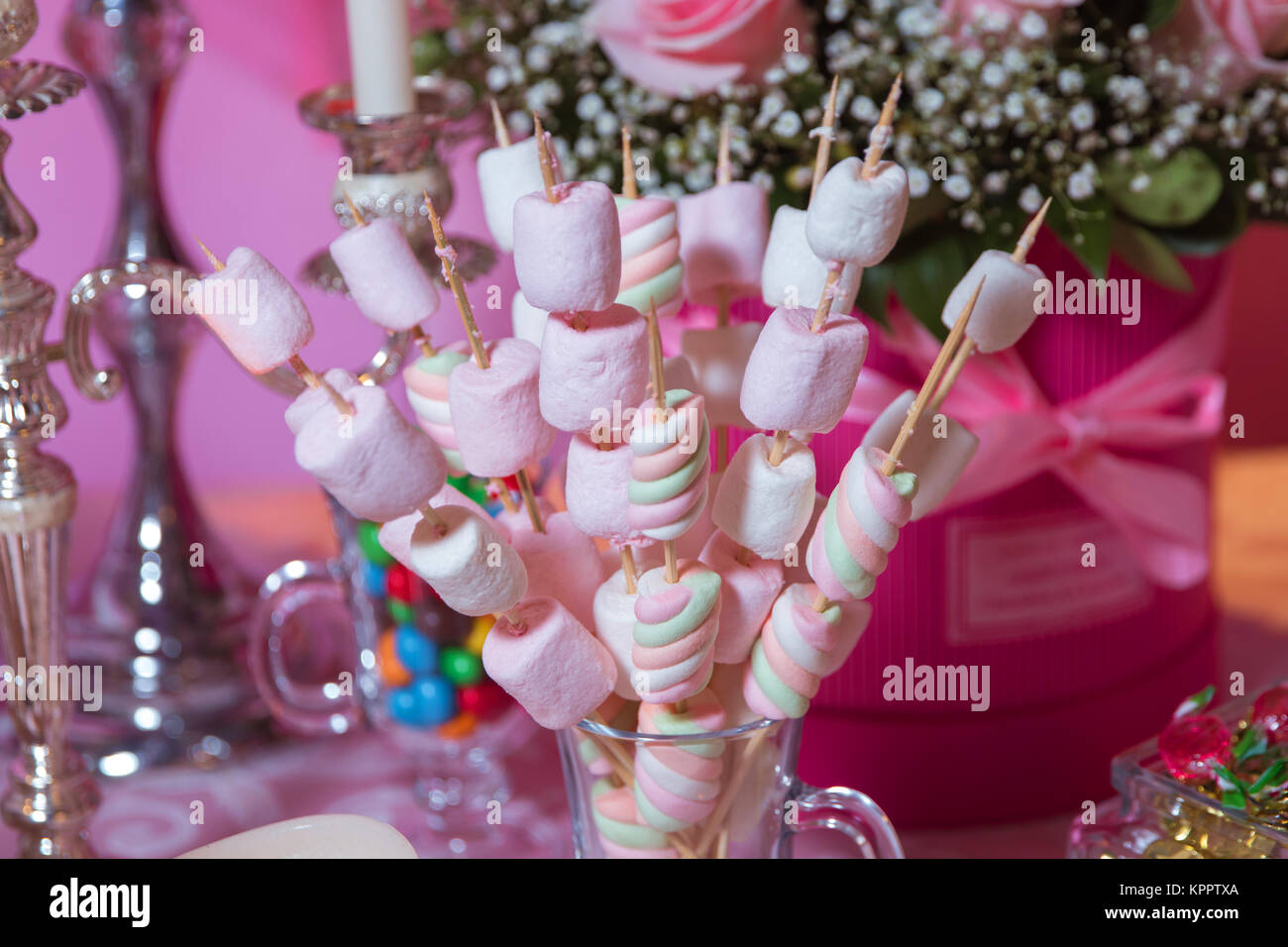 Dessert table for a party. Marshmallow skewers Candy Bar Stock Photo