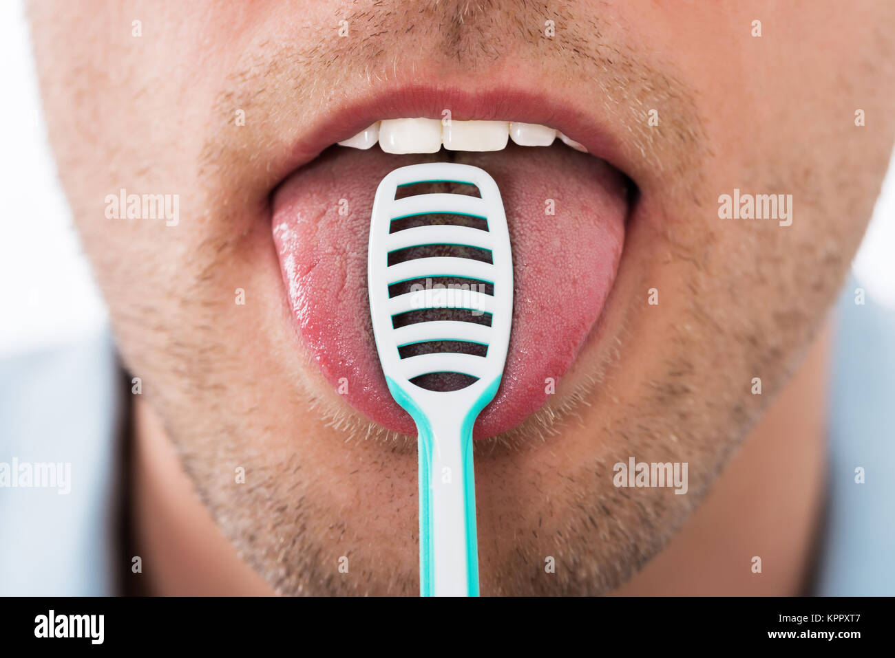 Man Cleaning Her Tongue Stock Photo