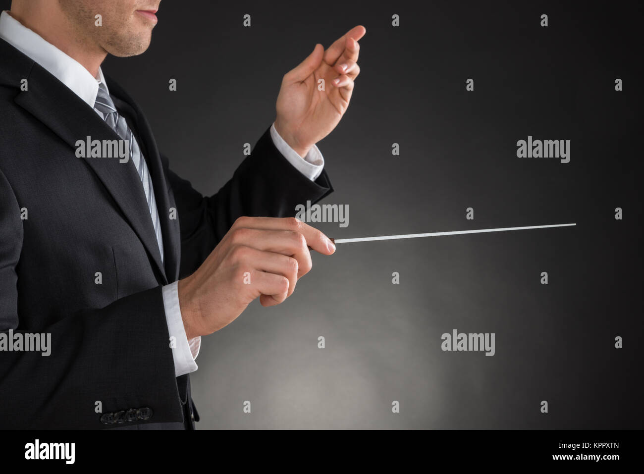 Person Directing With A Conductor's Baton Stock Photo Alamy