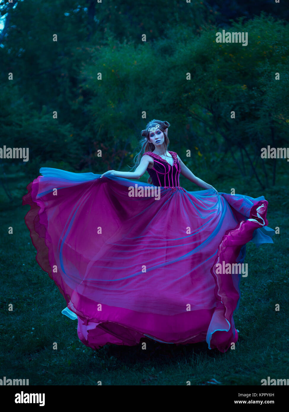 Elf woman in violet dress Stock Photo
