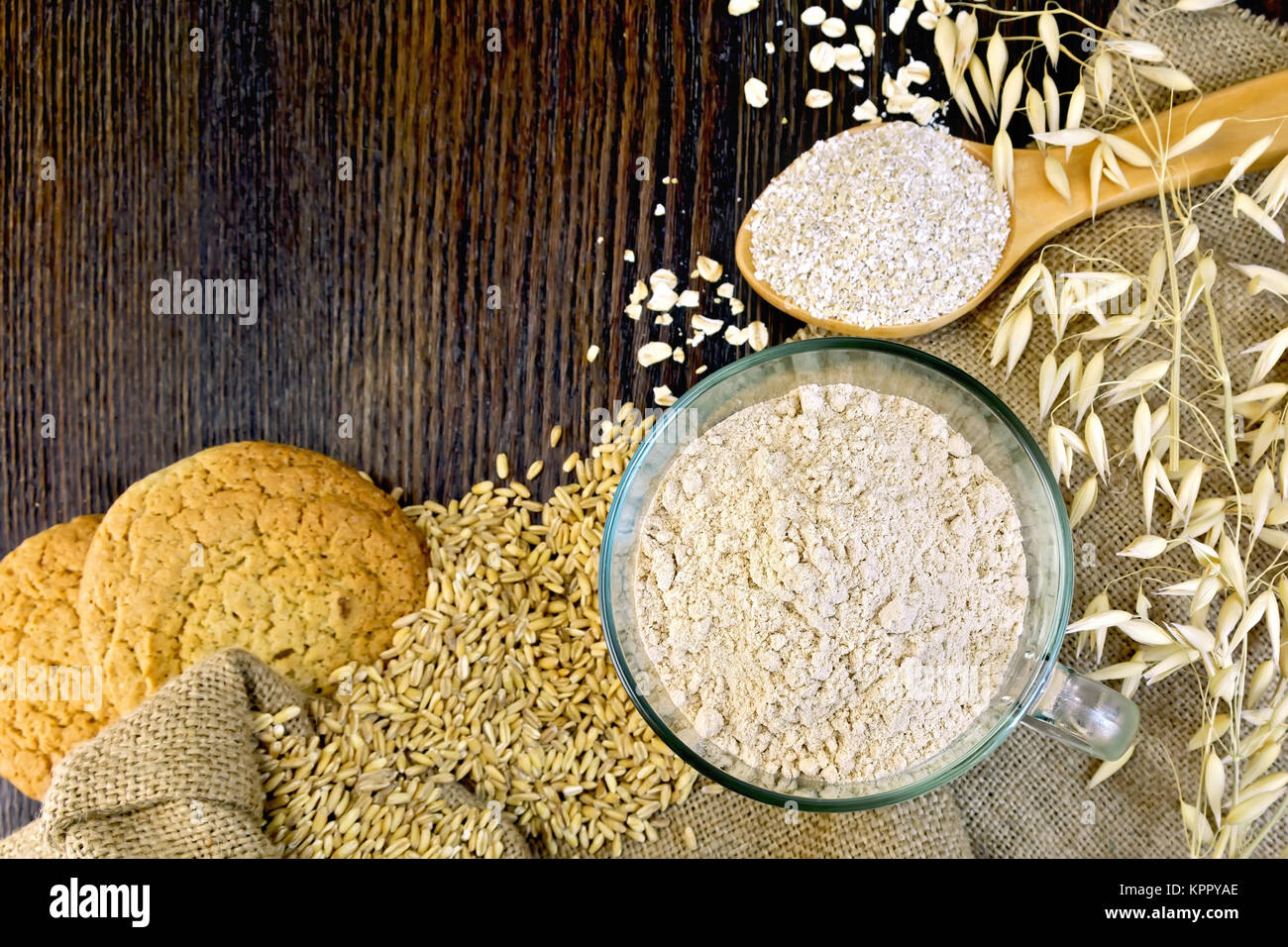 Flour and bran oat with cookies on board Stock Photo Alamy