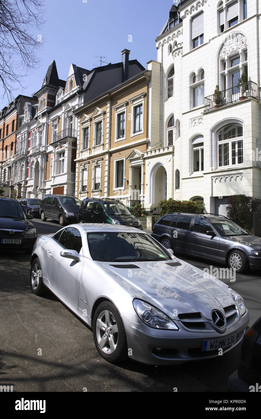 Germany, Wuppertal, houses at the Roonstreet in the district Brill, Mercedes SLK.  Deutschland, Wuppertal, Stadtteil Brill, Haeuser in der Roonstrasse Stock Photo