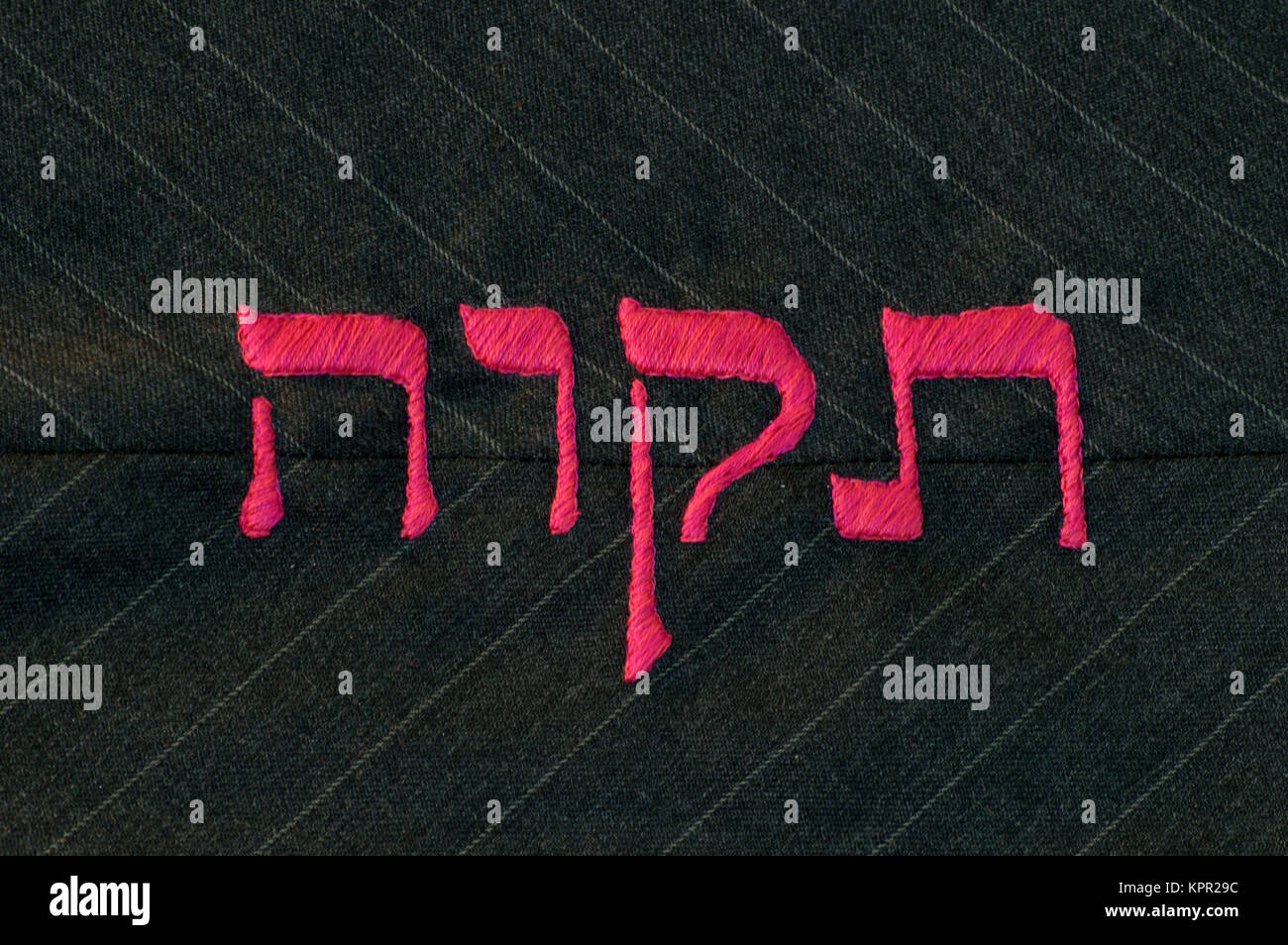 Hope in Hebrew language, stitched on fabric Stock Photo Alamy