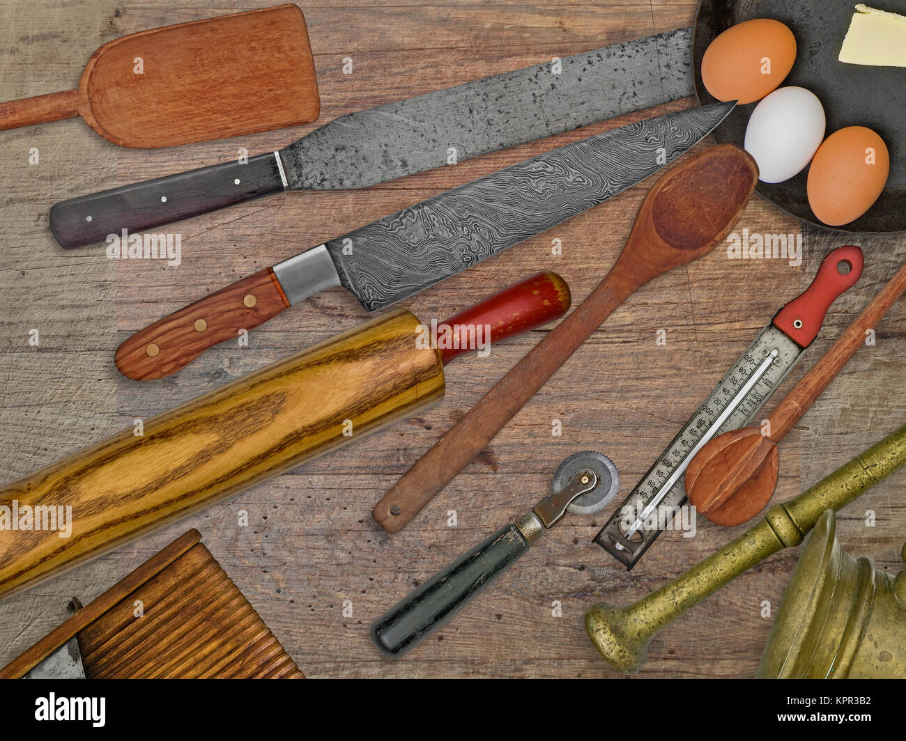 vintage bakery shop utensils over wooden table Stock Photo
