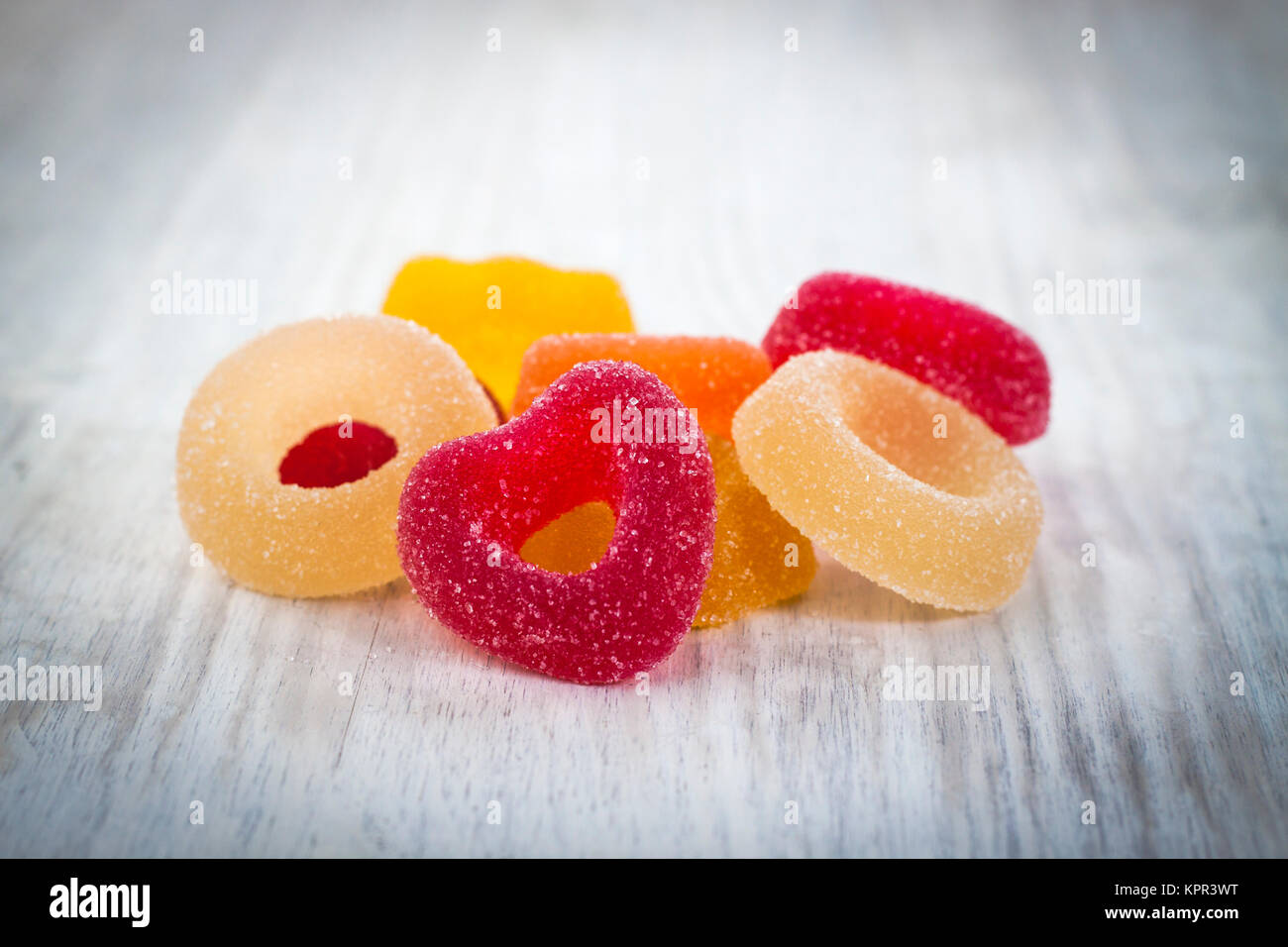 Colorful Jelly Candy on white wooden background Stock Photo - Alamy