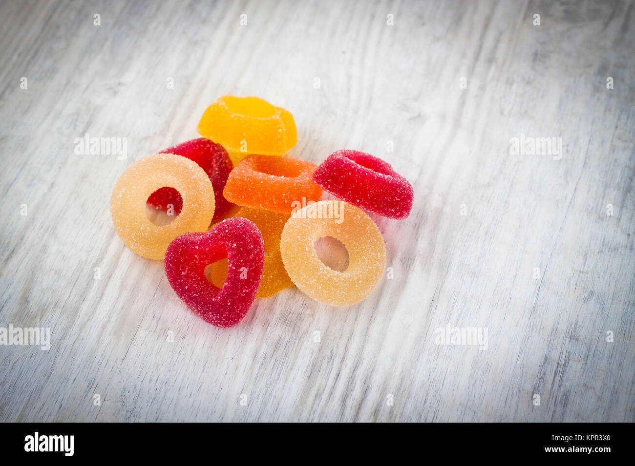 Colorful Jelly Candy on white wooden background Stock Photo
