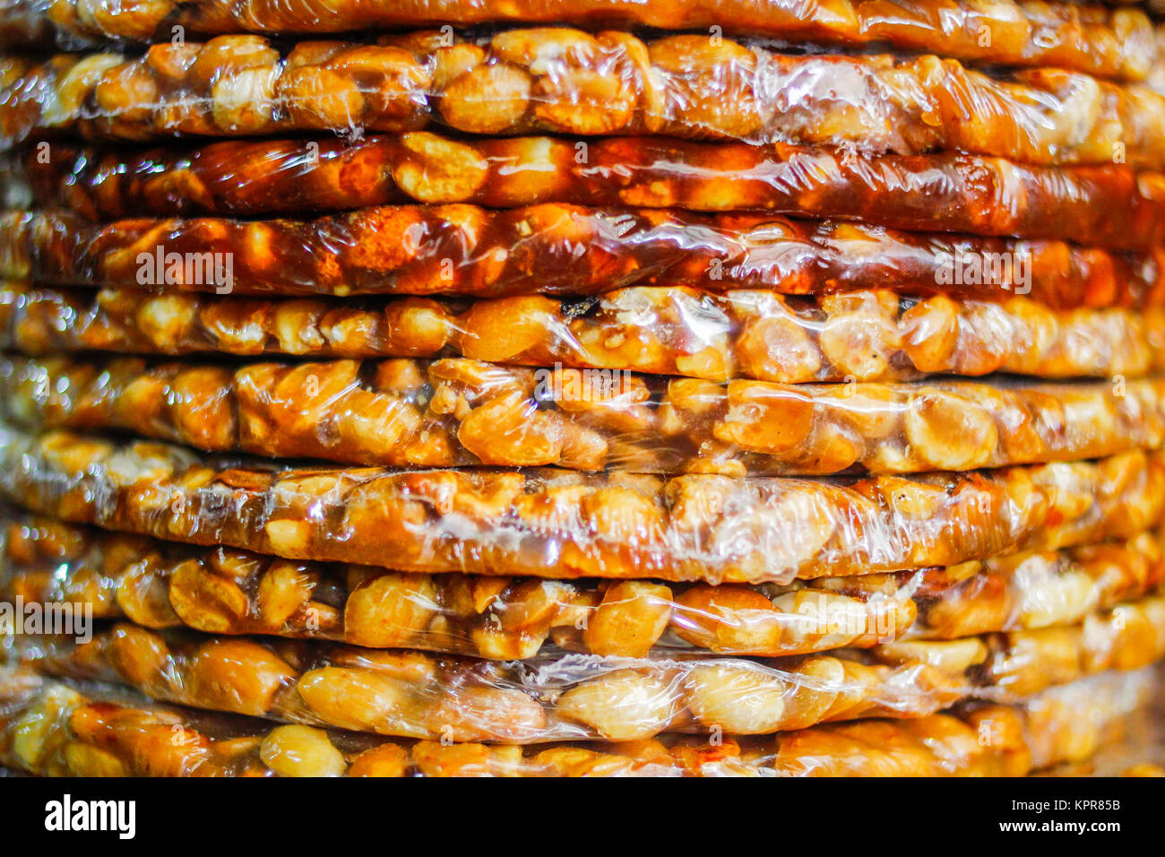 Collection of peanuts covered in fudge and sold as local delicious sweets on the streets of Rio de Janeiro in Brazil Stock Photo