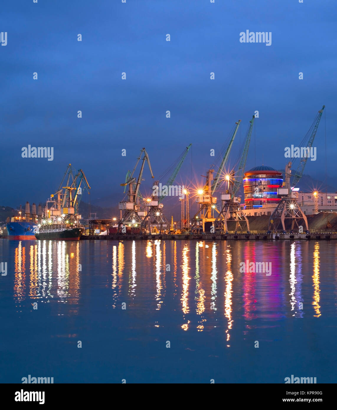 Commercial sea port at dusk Stock Photo - Alamy