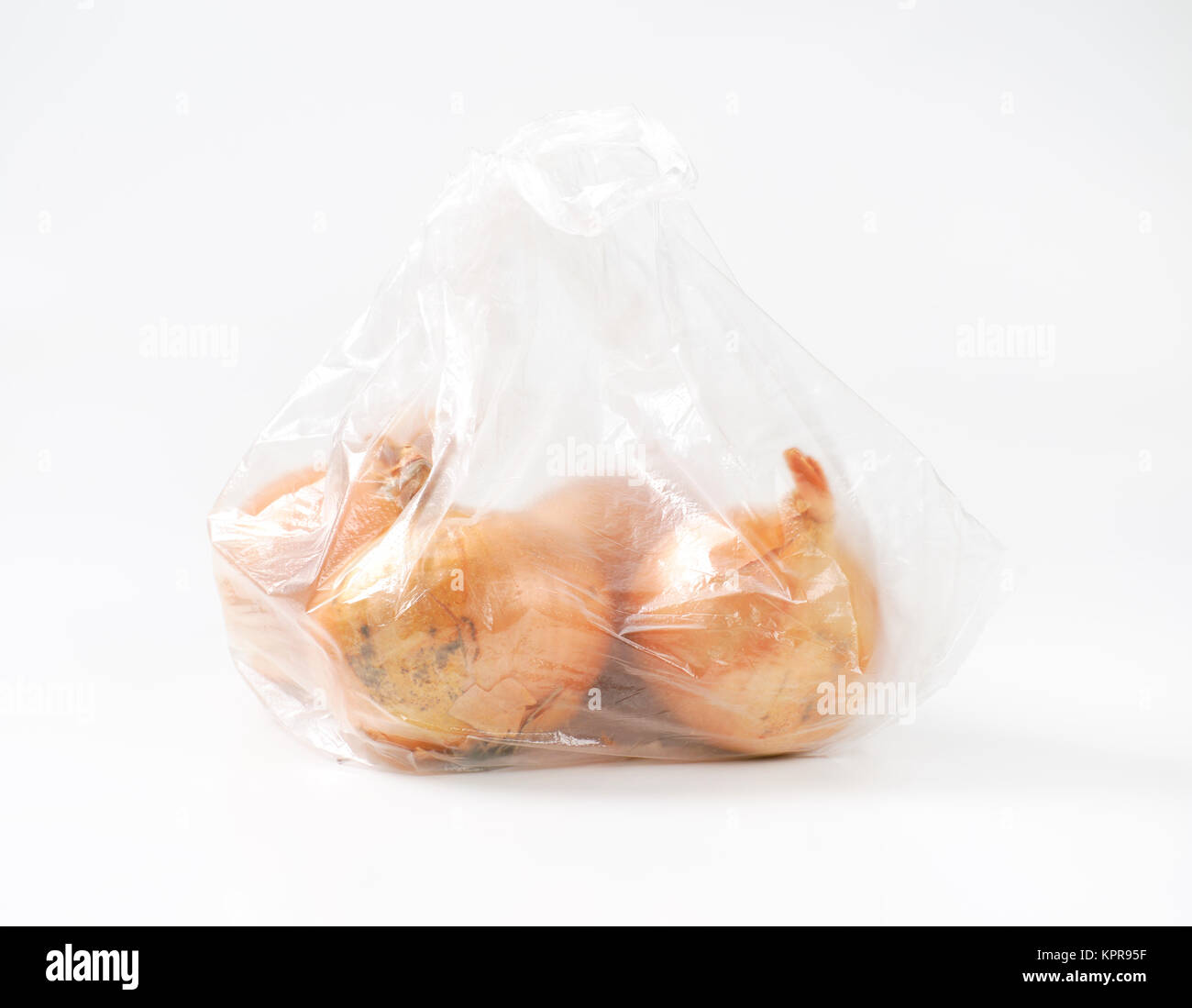 raw onions in plastic bag Stock Photo Alamy