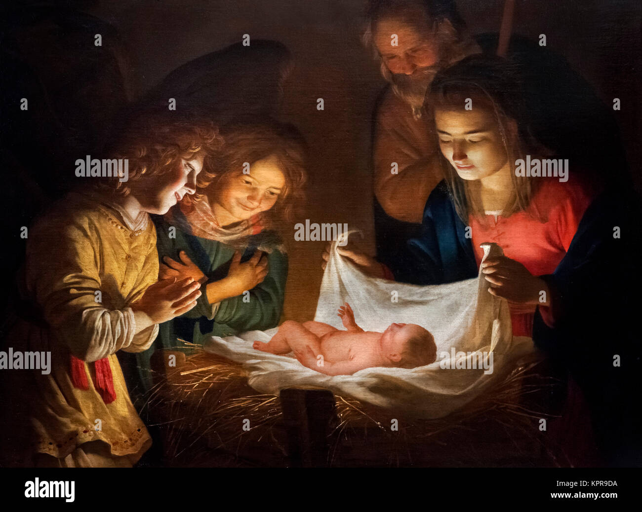 Adoration of the Child by Gerrit van Honthorst (Gherardo delle Notti, c. 1592-1656), oil on canvas, 1619-20. The painting shows a nativity scene with the baby Jesus, the Virgin Mary, Joseph and two angels. Stock Photo